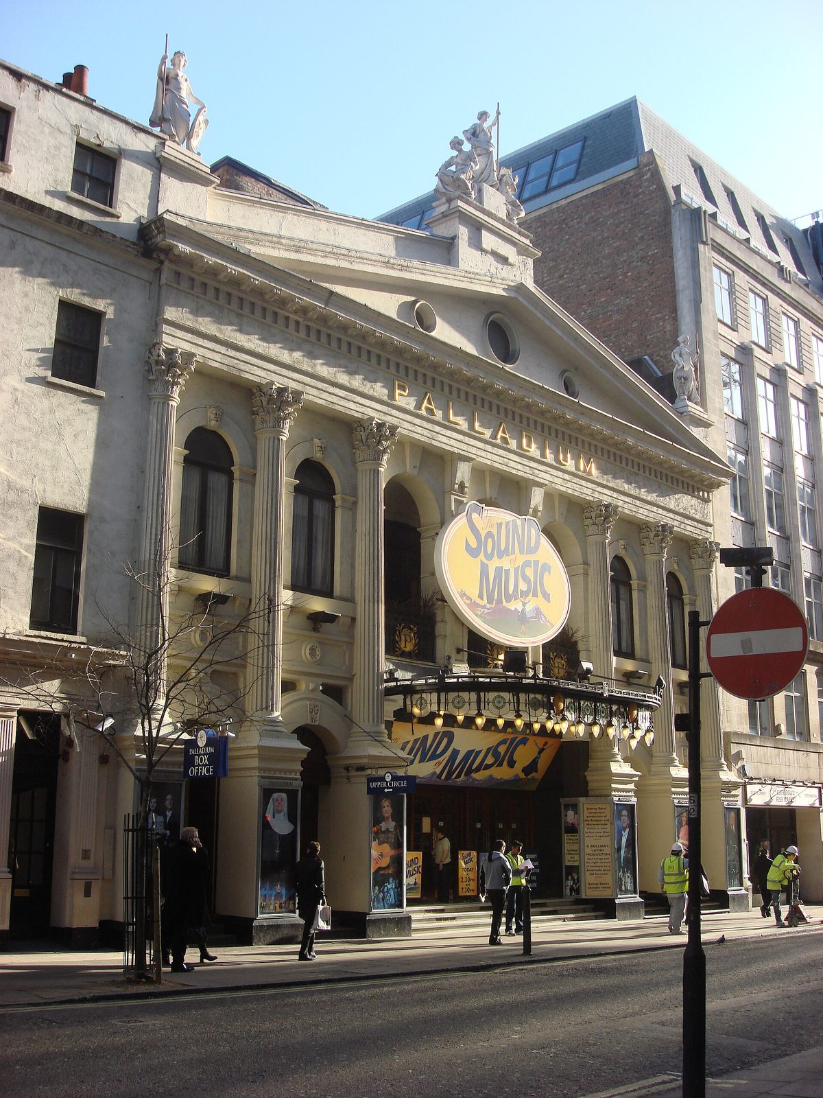 London Palladium facade, 'Sound of Music' sign, pedestrians, London Palladium