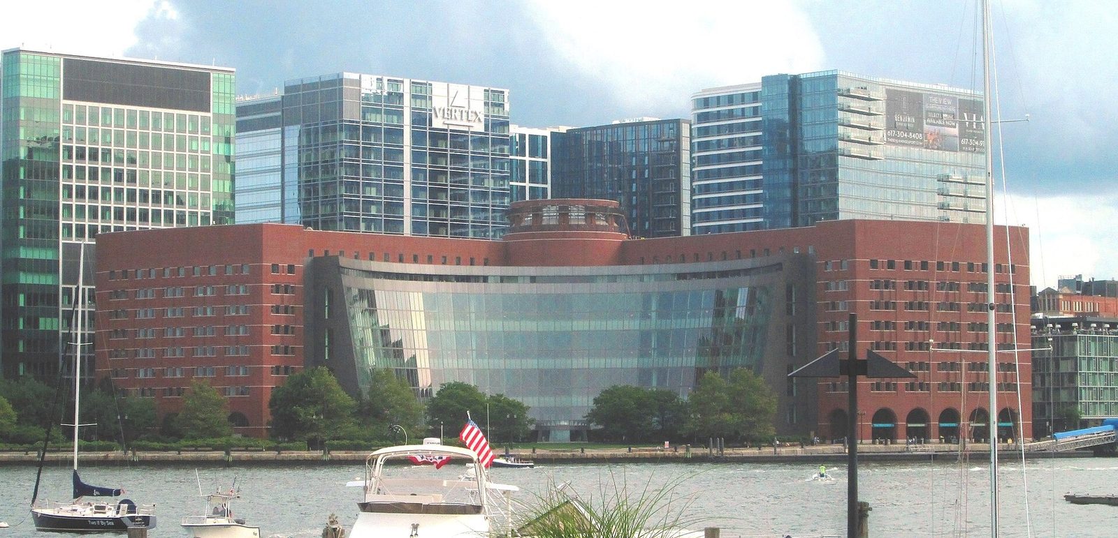 Moakley courthouse curved glass facade, harbor and boats in view, Massachusetts
