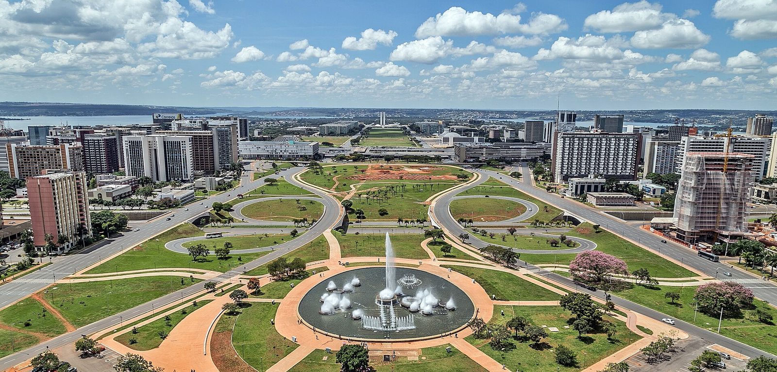 Aerial view of Brasília's Eixo Monumental, fountain and distant government buildings, Brasília