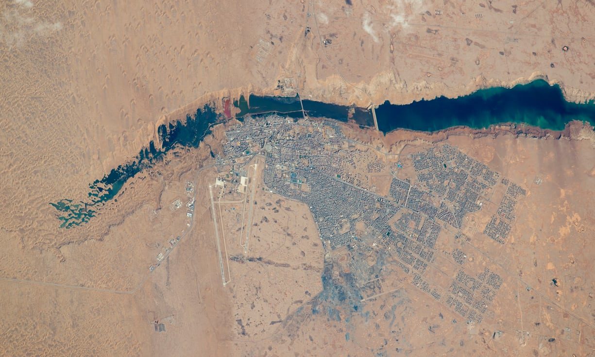 aerial satellite view of a city and coastal lagoon, Western Sahara