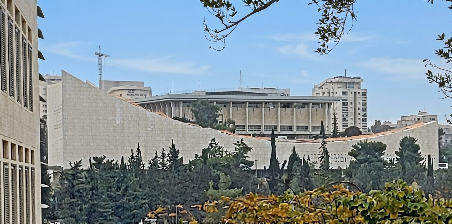 Curved modern library roof, Knesset building visible behind trees