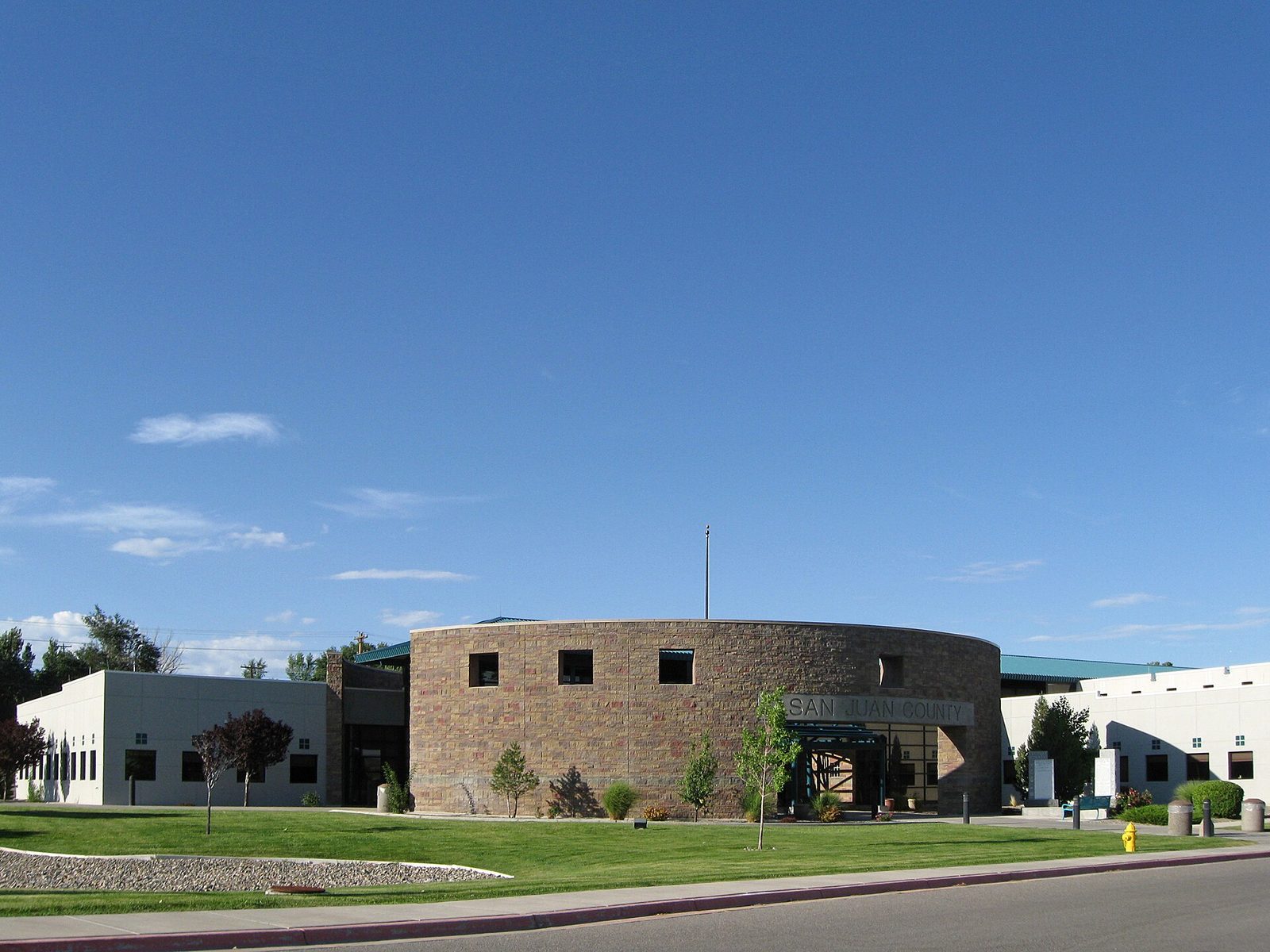 low circular stone public building under a clear blue sky, San Juan County