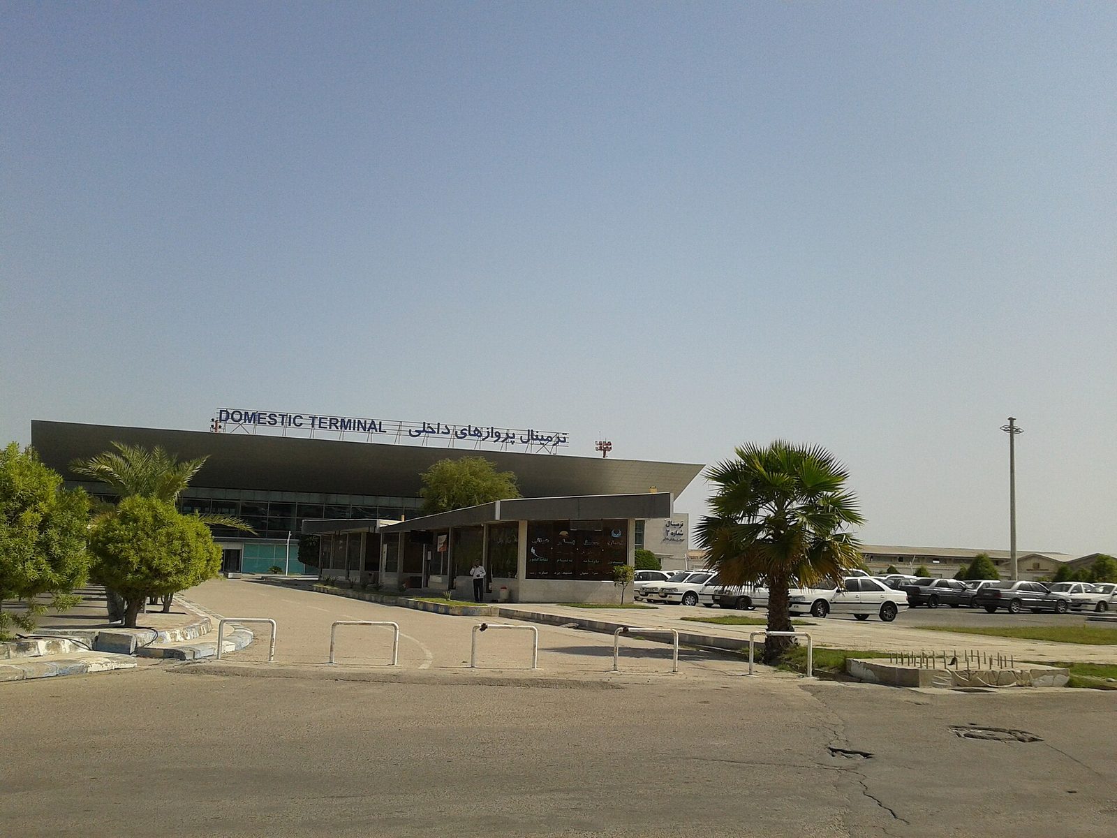 domestic terminal building with 'DOMESTIC TERMINAL' sign, cars, Bandar Abbas