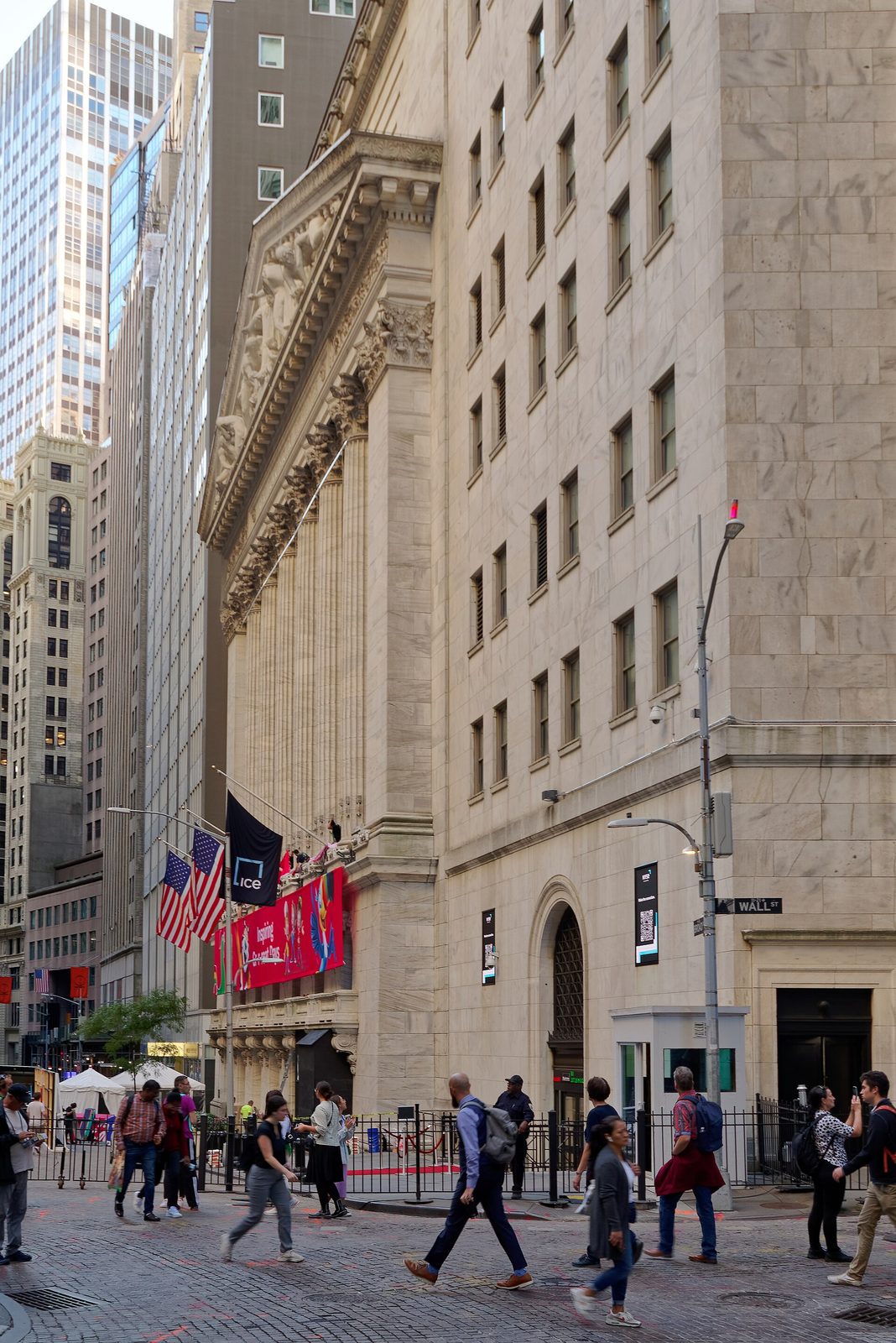Stock exchange facade with ICE banner and US flags