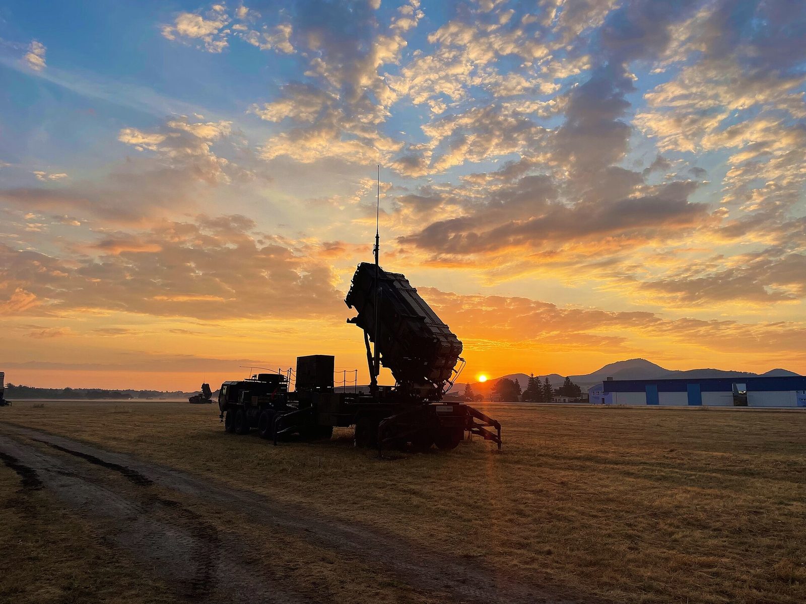 Silhouette of a Patriot launcher at sunrise, colourful sky