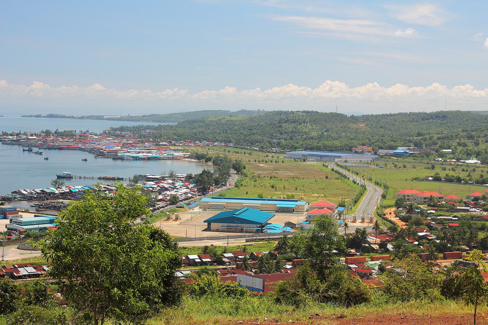 coastal port and harbour, colourful low buildings and shoreline from hillside, Sihanoukville