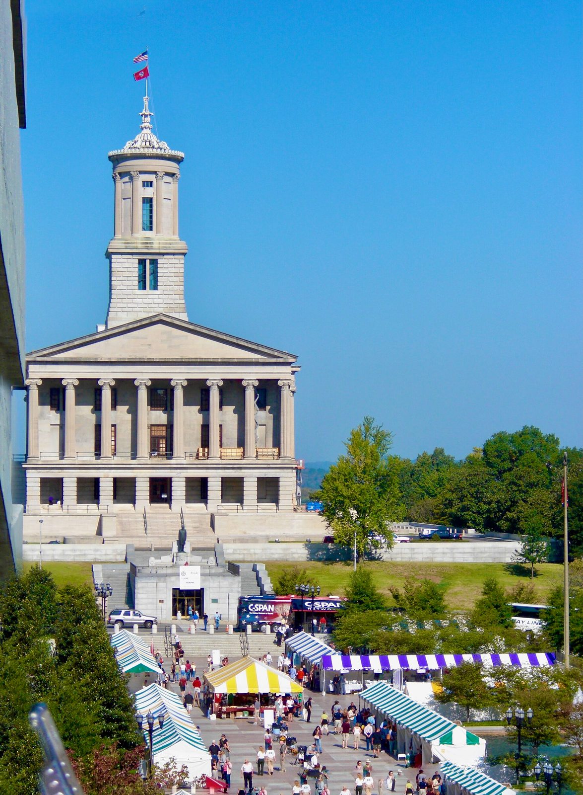 Classical government building with columned portico, tall central tower