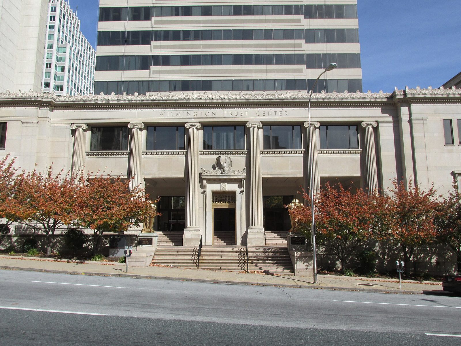 Neoclassical stone federal building along a river, colonnade and windows., Wilmington