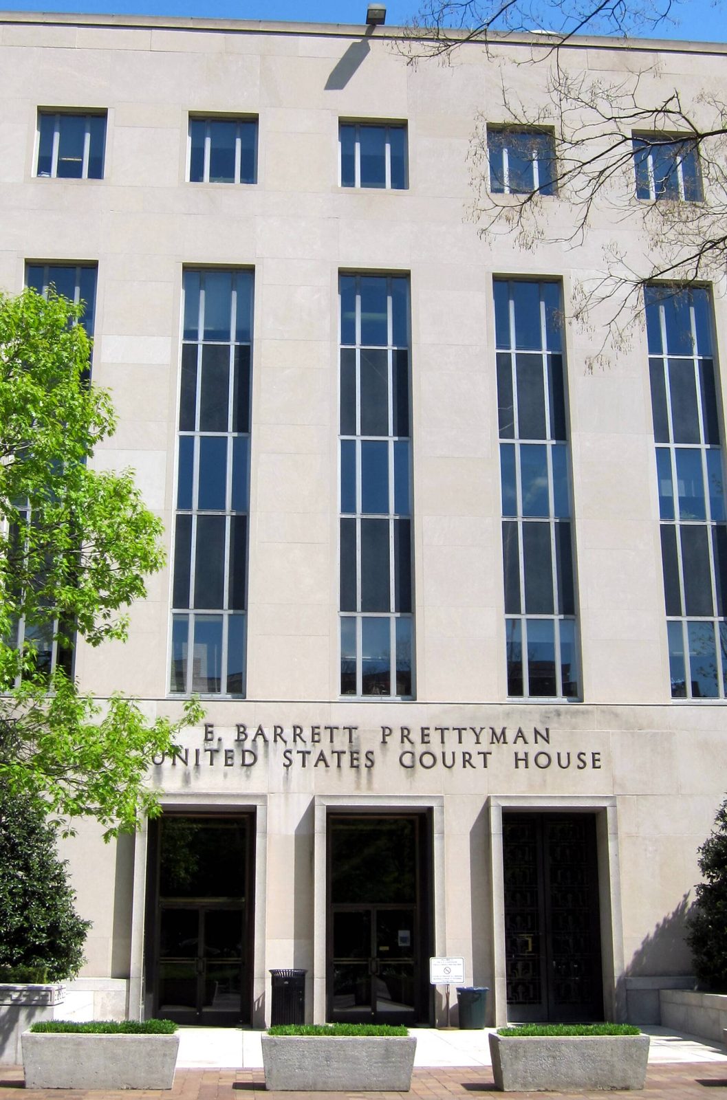 Courthouse west entrance, building name above three doorways, Washington