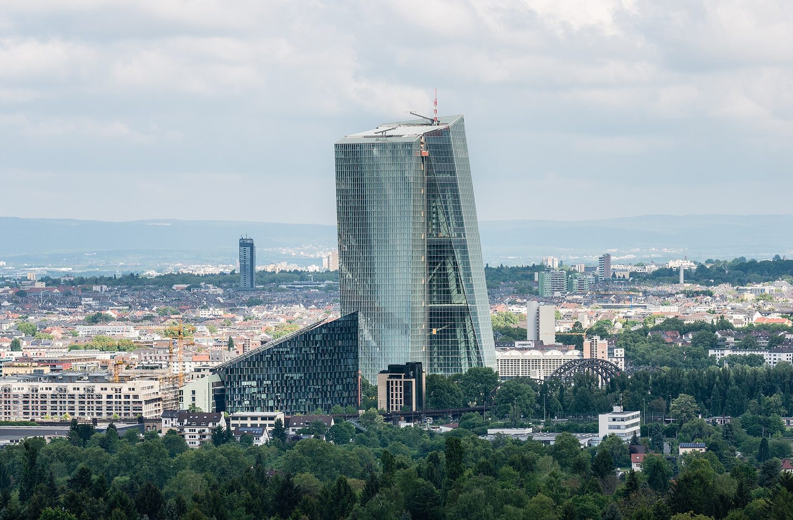 European Central Bank headquarters tower, surrounding buildings and trees, Frankfurt am Main