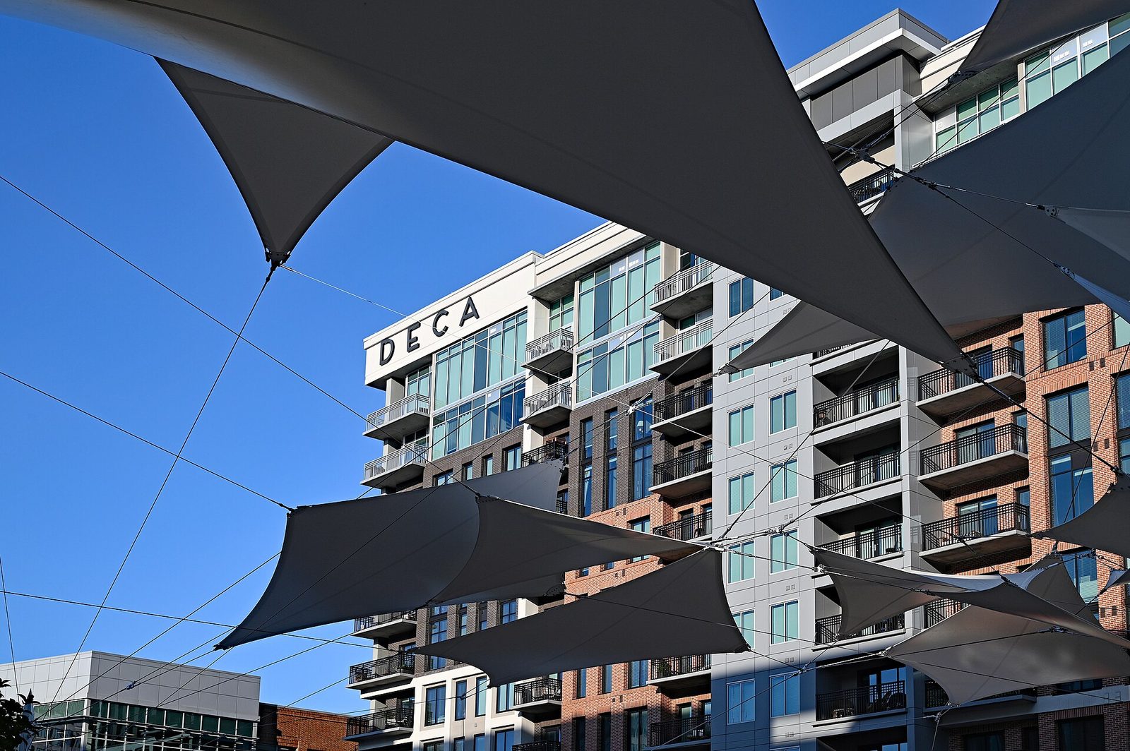 Large modern apartment complex, multistorey glass and brick facades, Greenville