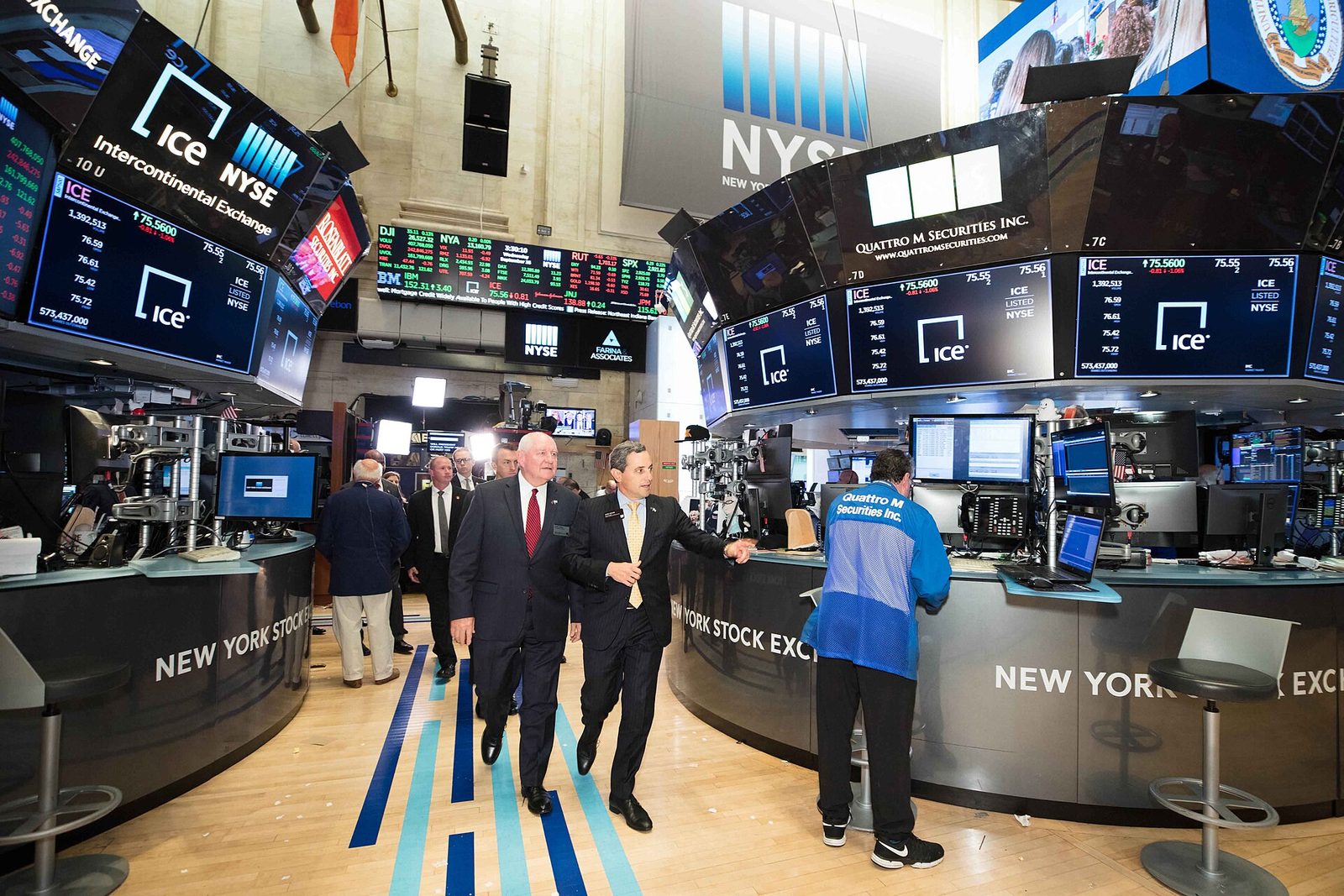 Wide view of NYSE trading floor, electronic tickers and desks, New York Stock Exchange