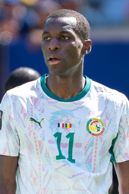 Head-and-shoulders portrait of a footballer in Senegal national shirt