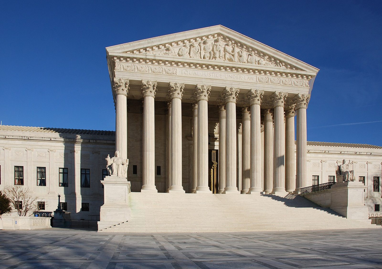 Neoclassical stone courthouse, wide steps and tall Corinthian columns
