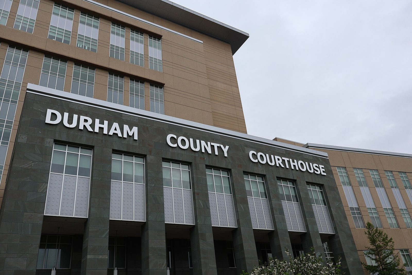 Front facade with large 'DURHAM COUNTY COURTHOUSE' lettering on entrance, Durham County Courthouse