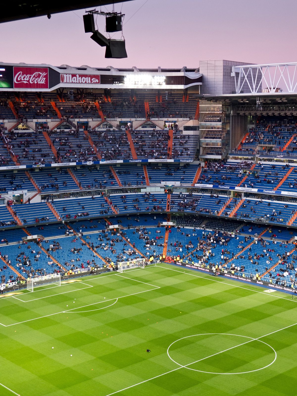 Football pitch, lower stands and sparse crowd inside stadium, Santiago Bernabéu