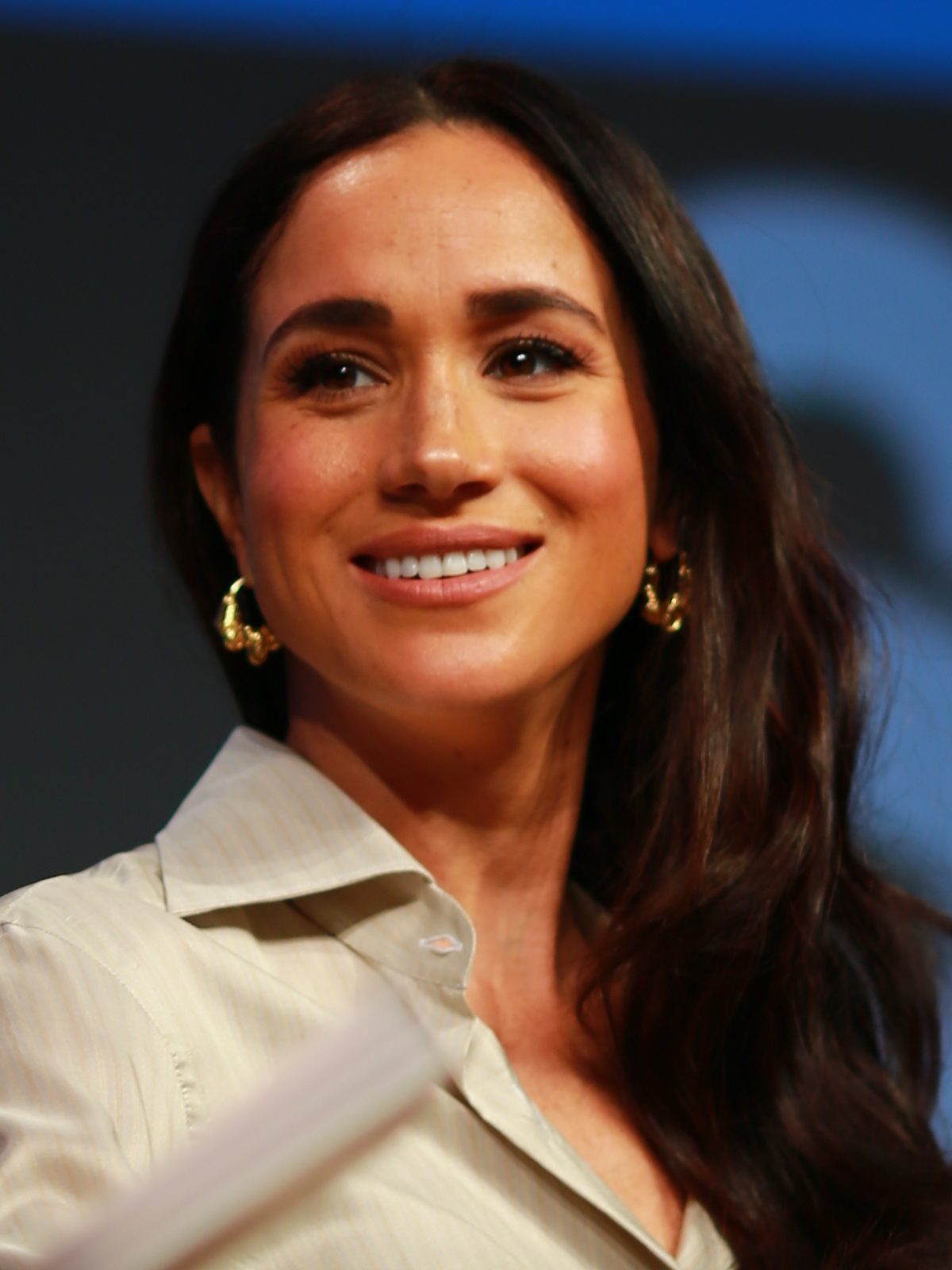 Close portrait of a smiling woman at an event, head and shoulders