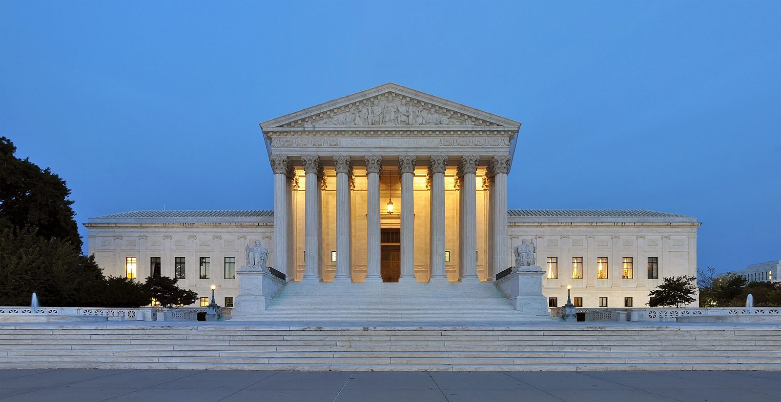 Front facade of the U.S. Supreme Court building at dusk