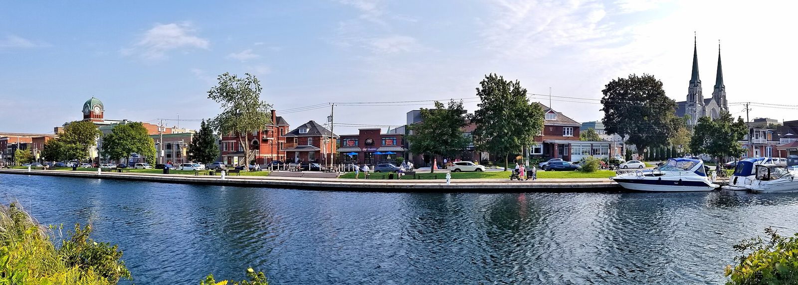 Riverfront promenade, buildings and boats in Salaberry-de-Valleyfield
