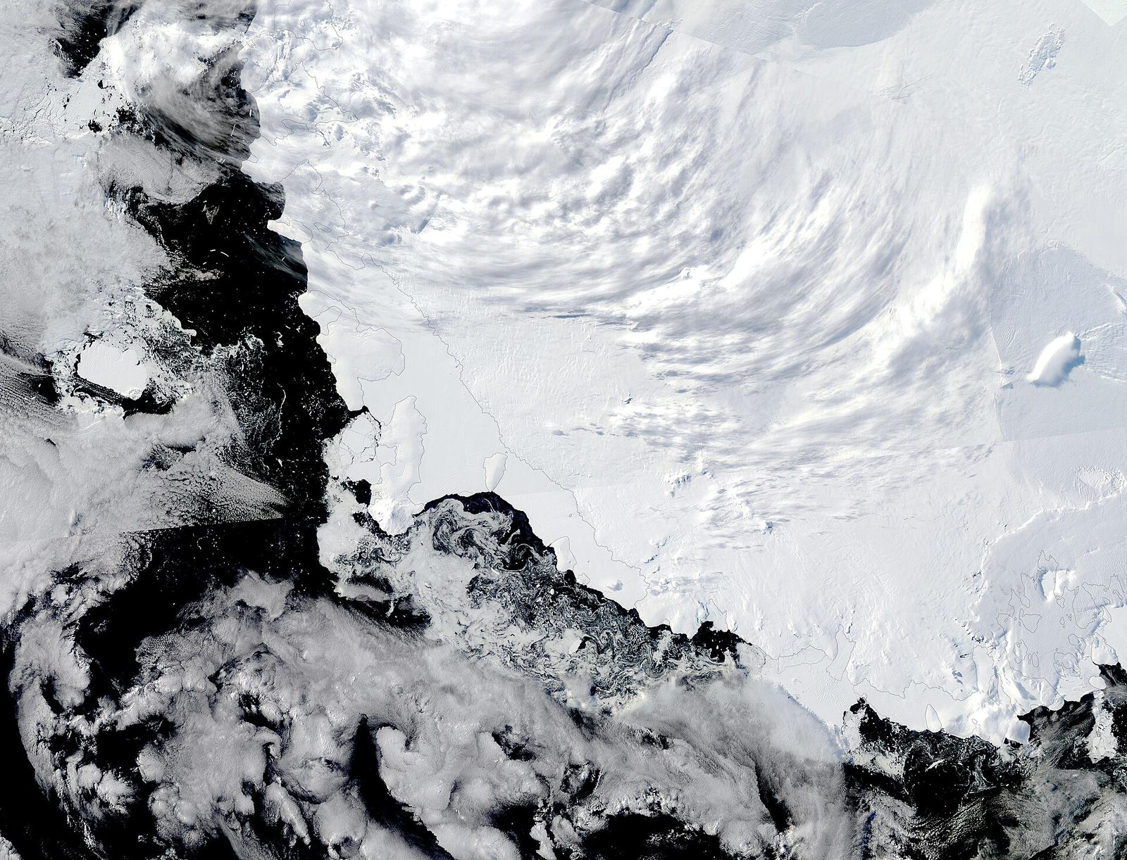 Satellite image of Antarctic coast, sea ice and cloud bands, Southern Ocean