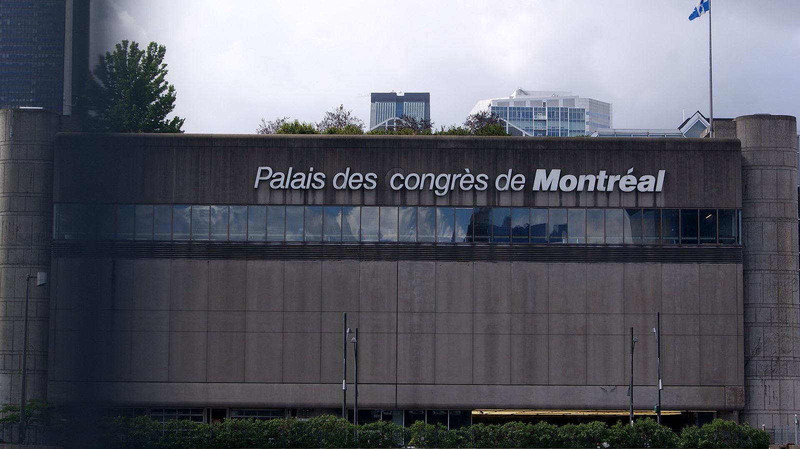 Facade of Palais des congrès de Montréal with large building sign, Montreal