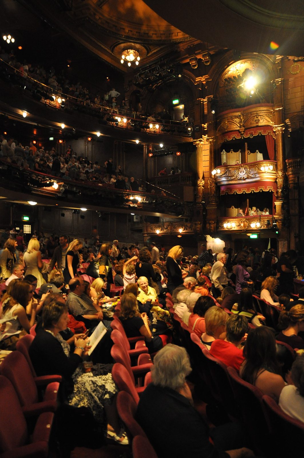 auditorium crowd and ornate private boxes inside theatre, London Palladium
