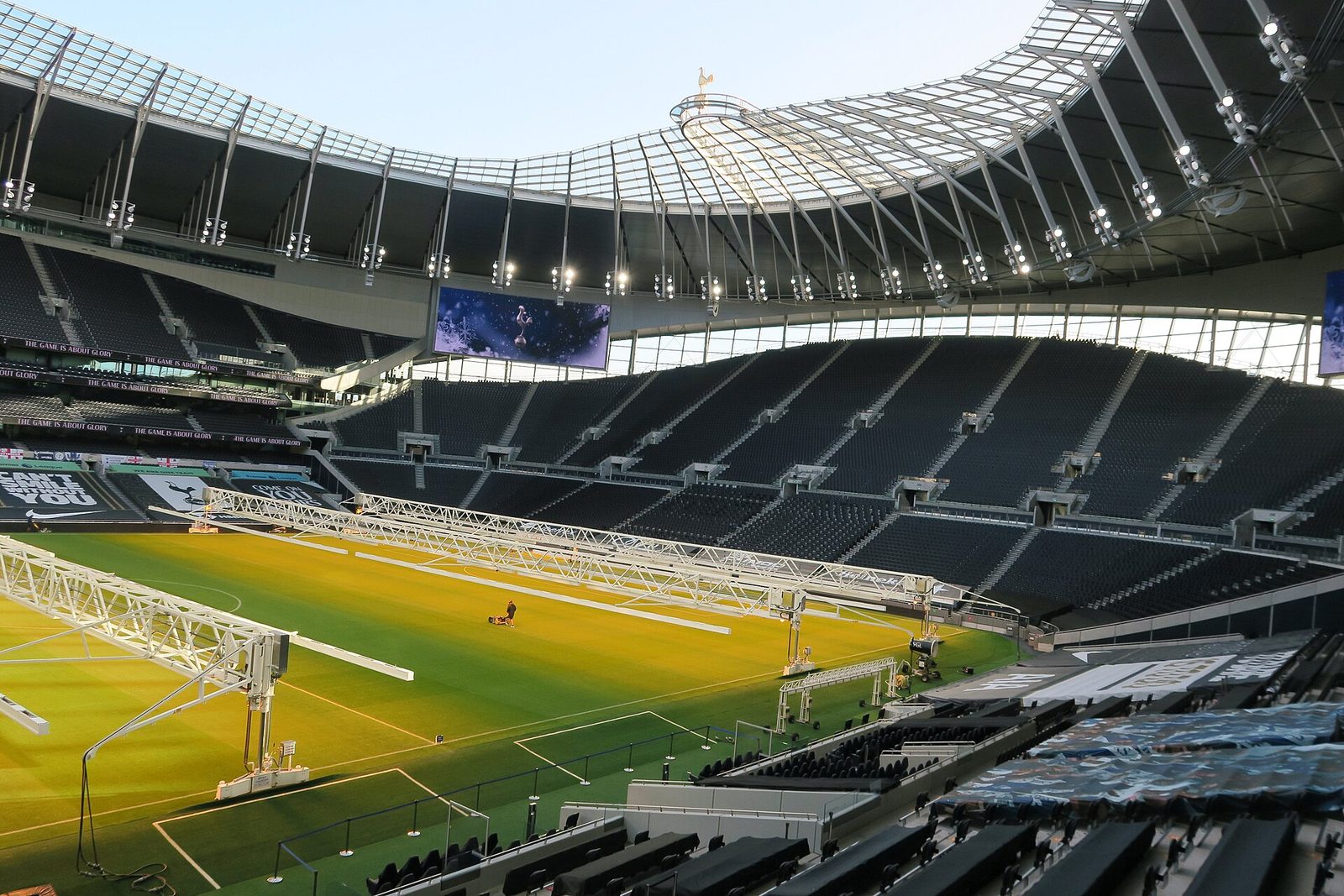 empty stadium interior, pitch and South Stand seating under the roof, Tottenham Hotspur Stadium