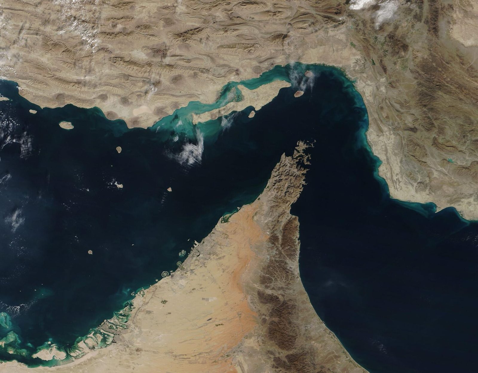 satellite image of the Strait of Hormuz showing peninsula and coastal waters, Strait of Hormuz