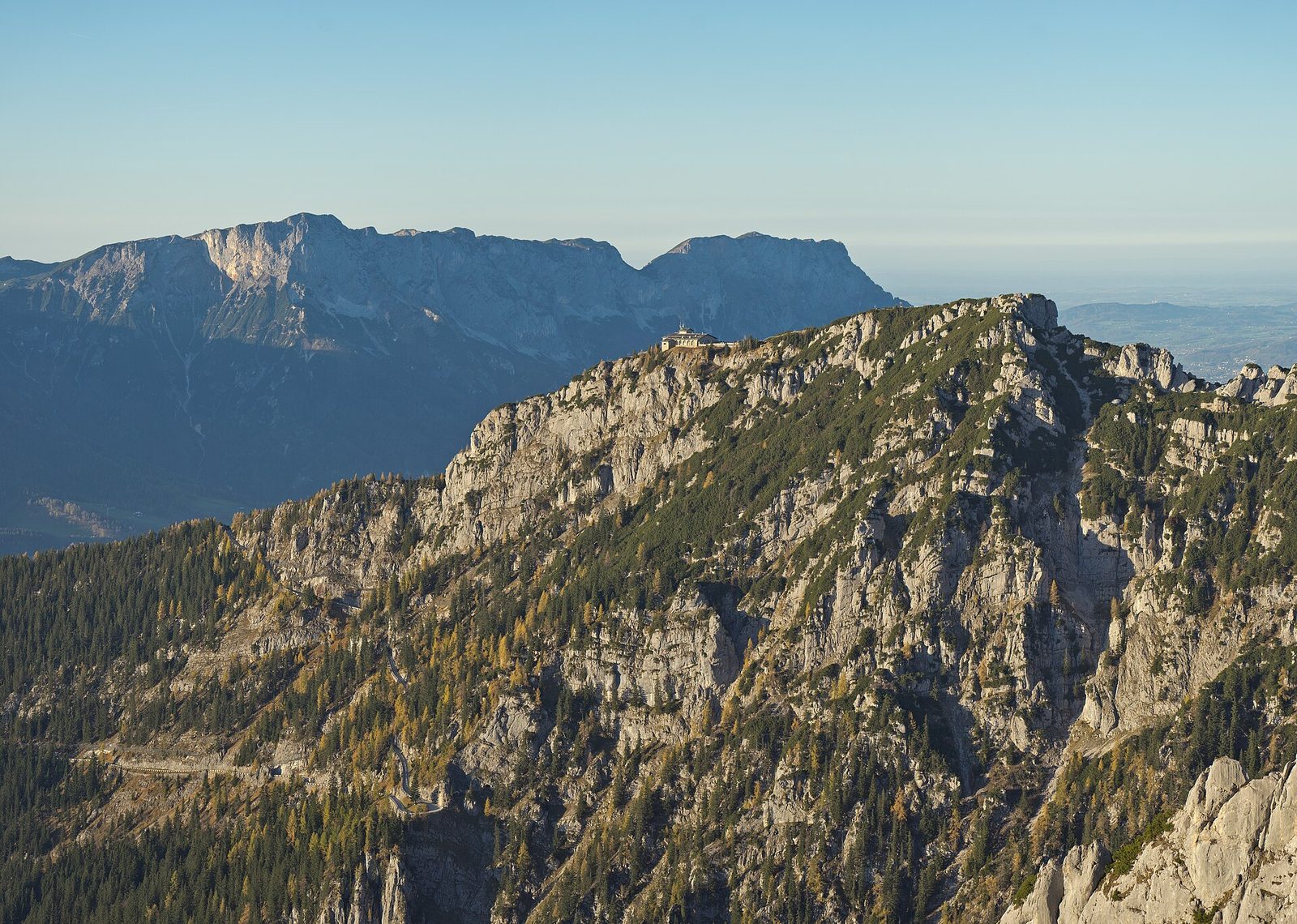 distant Kehlsteinhaus on rocky ridge, mountains in background, Kehlsteinhaus