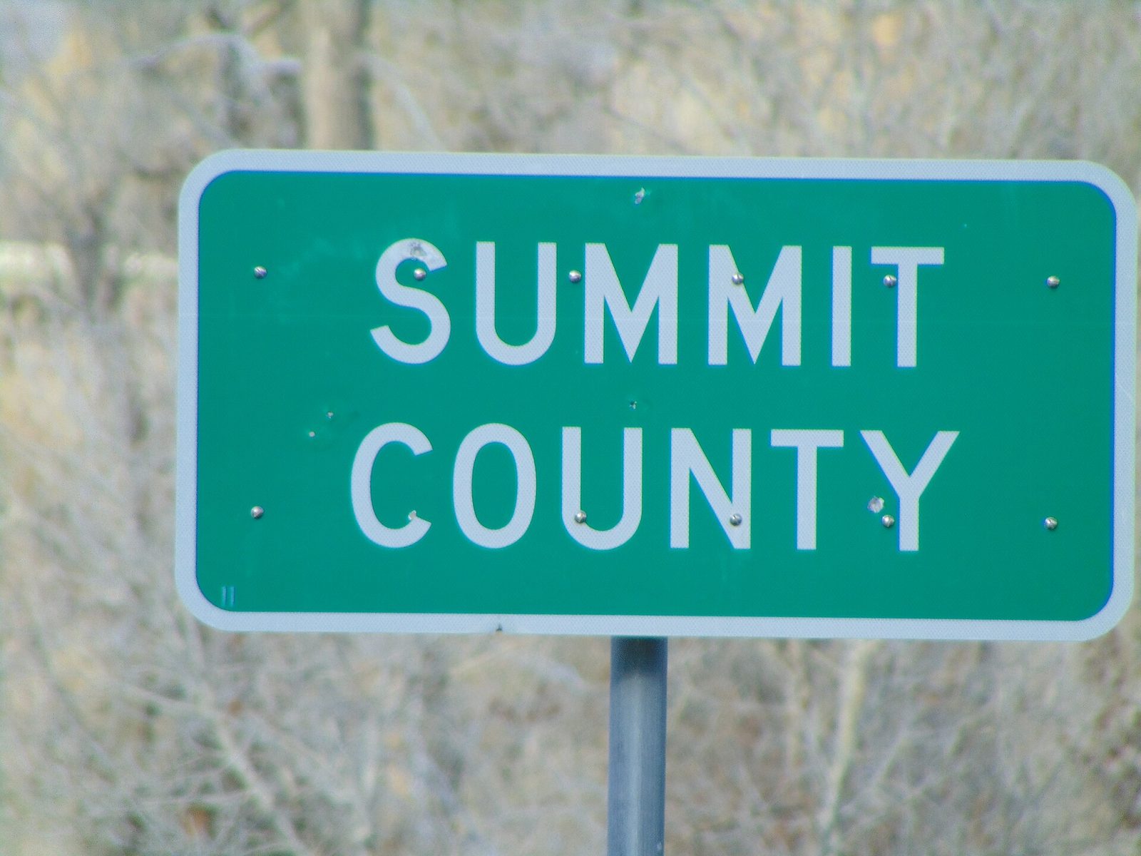 green road sign reading SUMMIT COUNTY, Summit County