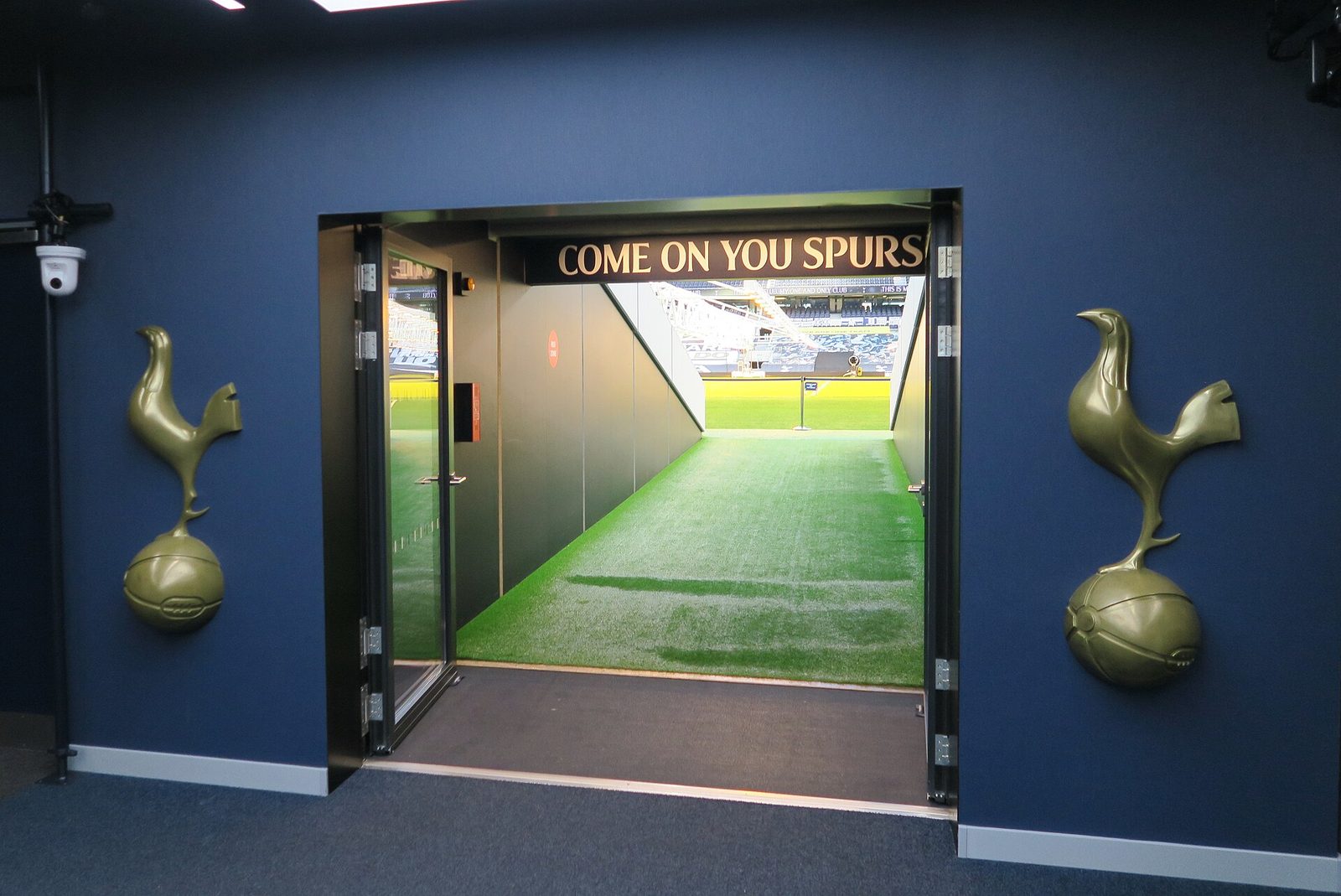 players' tunnel entrance to the pitch, 'COME ON YOU SPURS' sign visible, Tottenham Hotspur Stadium