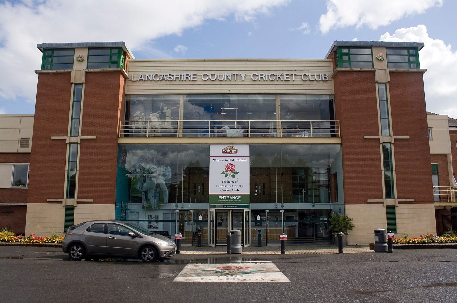 Front entrance of Lancashire County Cricket Club building with signage