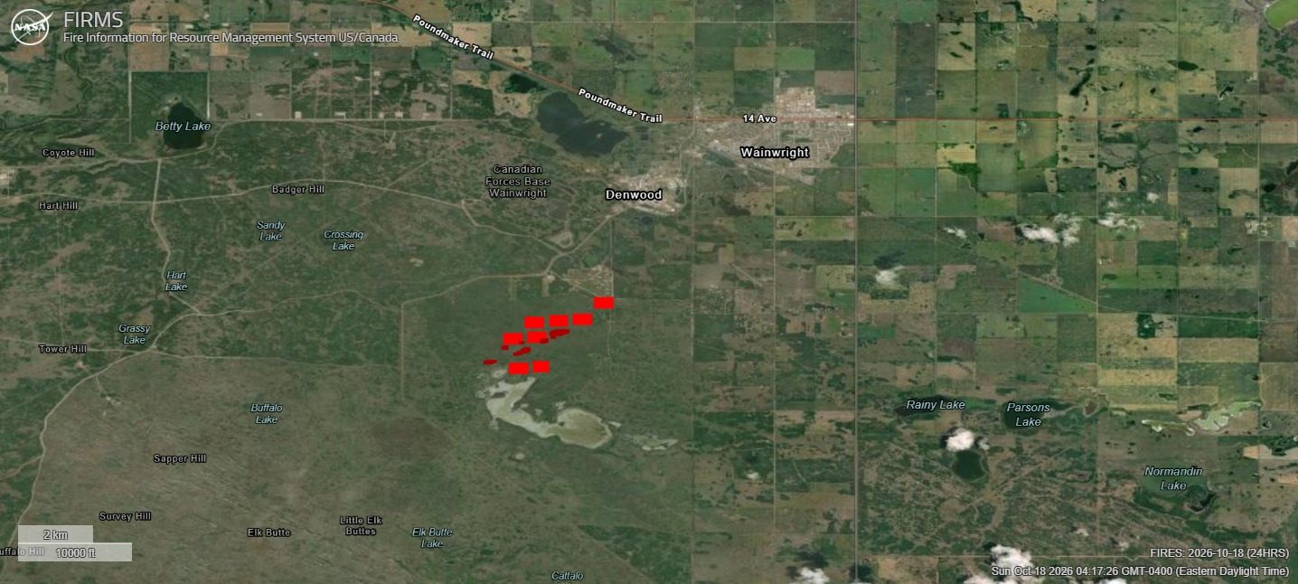 satellite map showing red fire hotspots near 'Wainwright' label