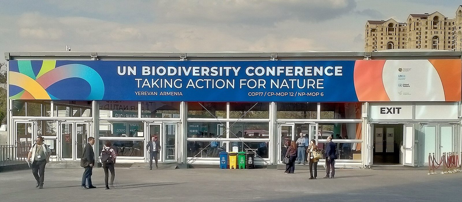 Venue entrance with 'UN Biodiversity Conference, Taking Action for Nature' banner, Yerevan