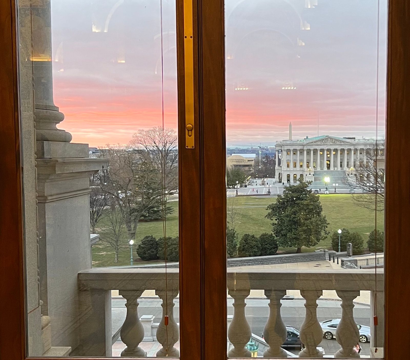 View of Supreme Court with Washington Monument, seen through window