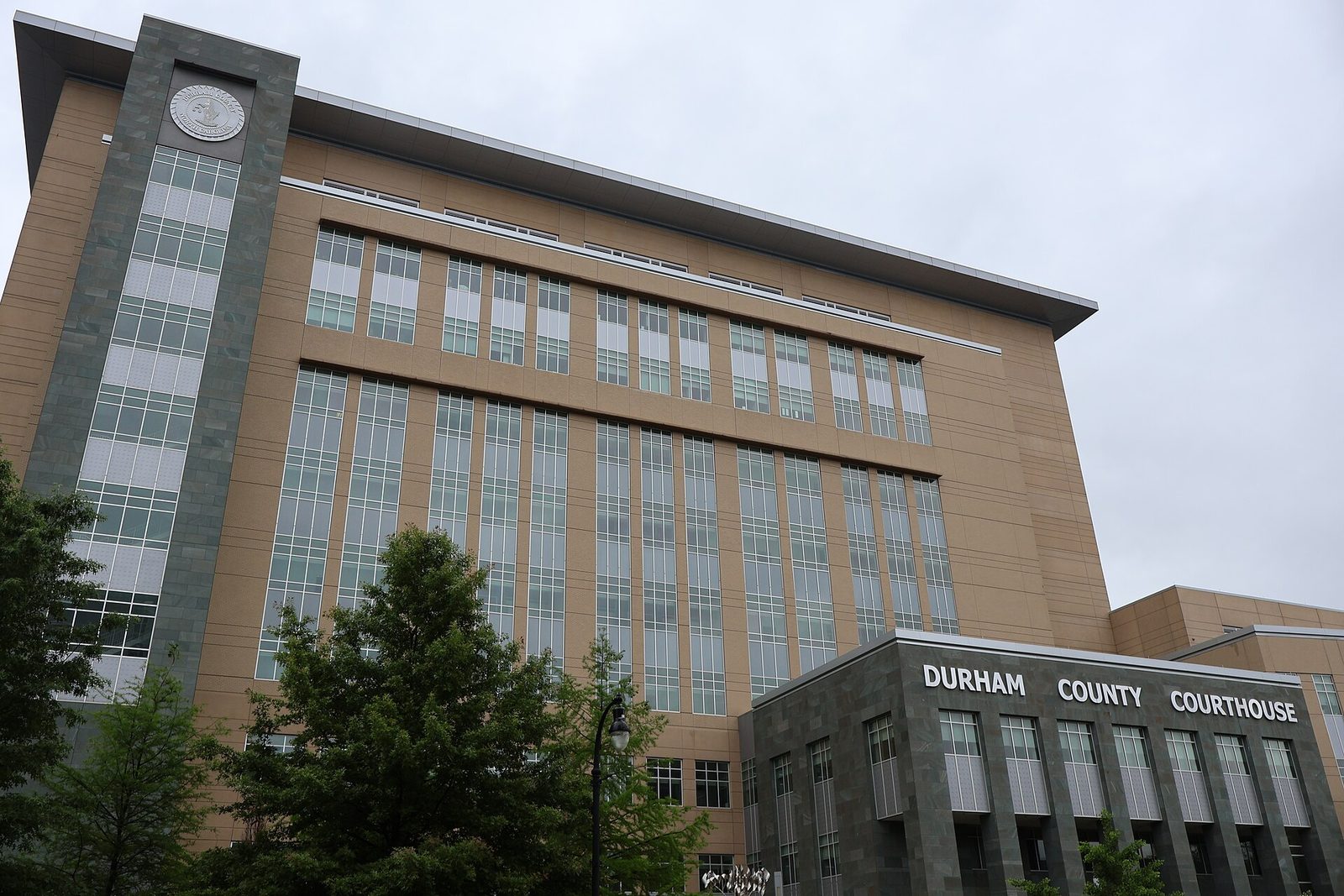 Durham County Courthouse sign on building facade, overcast sky, Durham County Courthouse