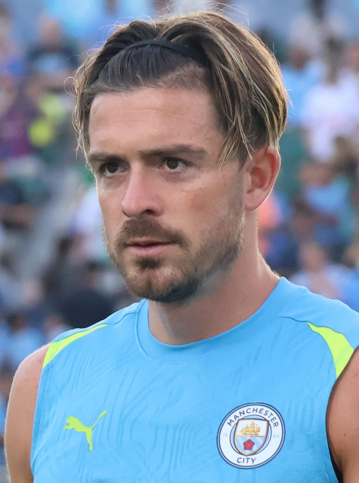 Close-up of a man in a sky-blue training top