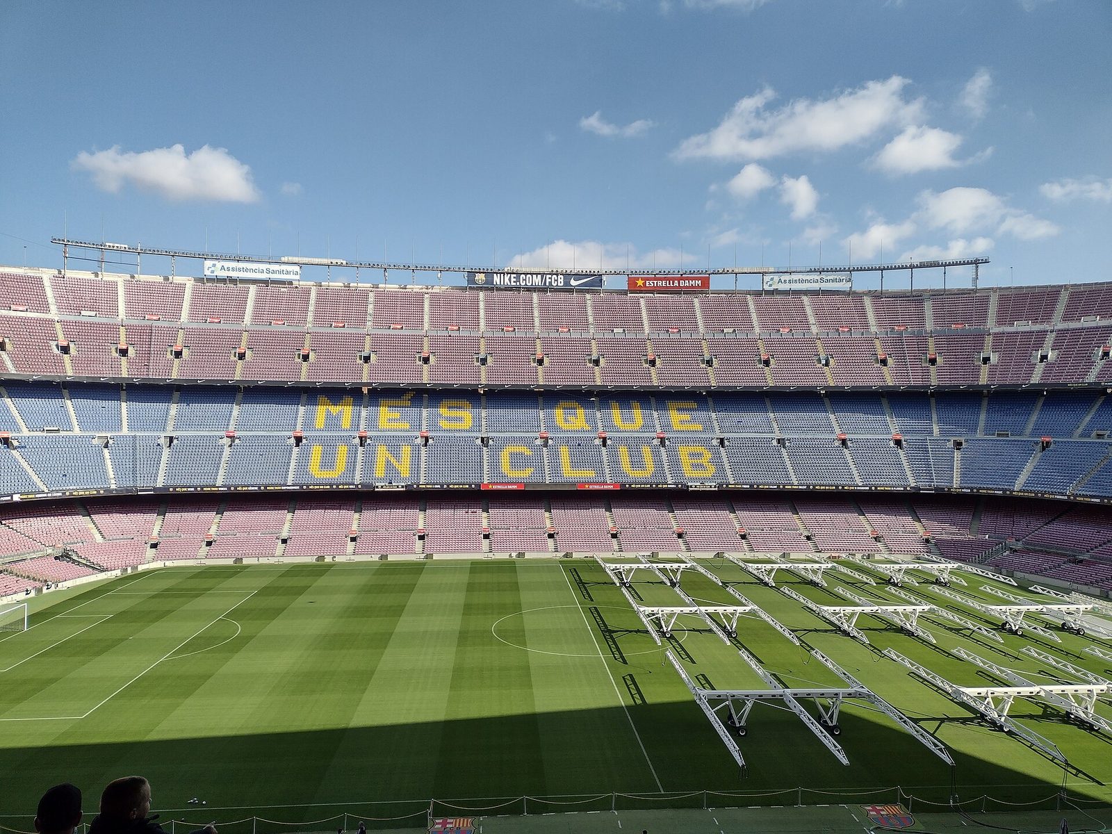 Wide view of Camp Nou, empty pitch, 'MES QUE UN CLUB' seats, Camp Nou