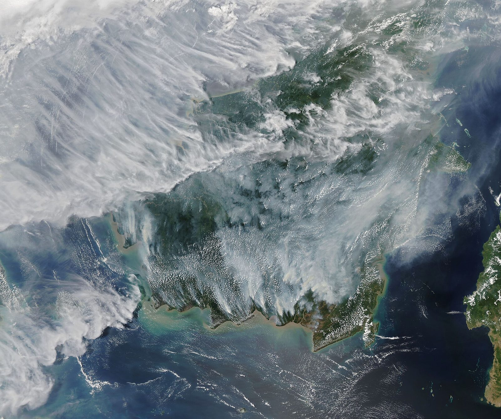 Satellite view of Borneo and Sumatra, widespread smoke and haze